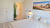Schlafzimmer 1 mit Doppelbett, TV und Ostseeblick