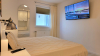 Schlafzimmer Nr.2 mit Doppelbett, Einzelbett und TV